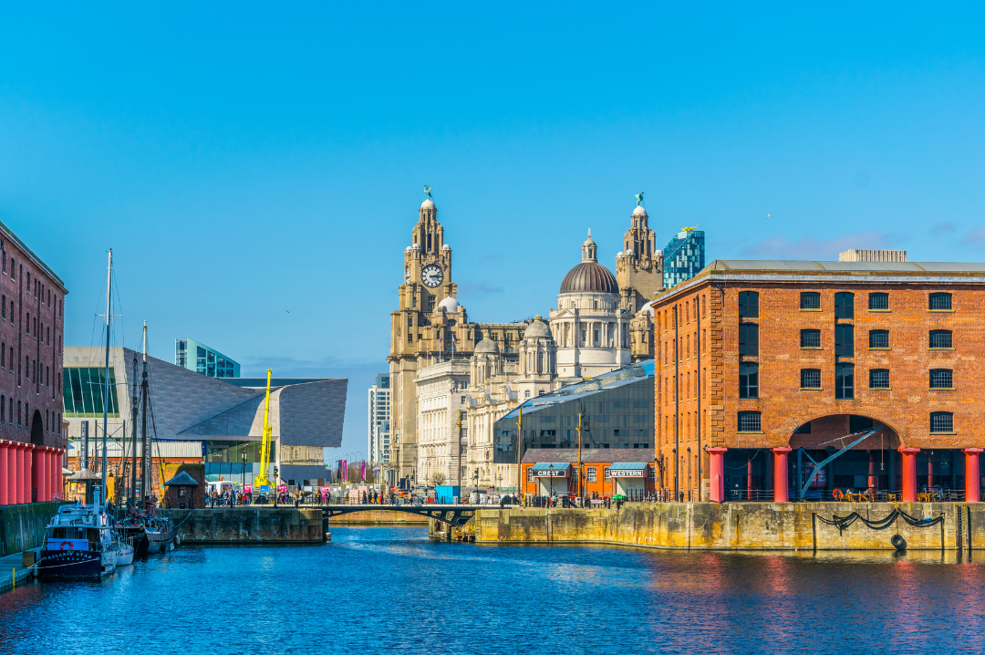Liverpool dock on a warm, bright sunny day. The Royal Liver Building in the background.